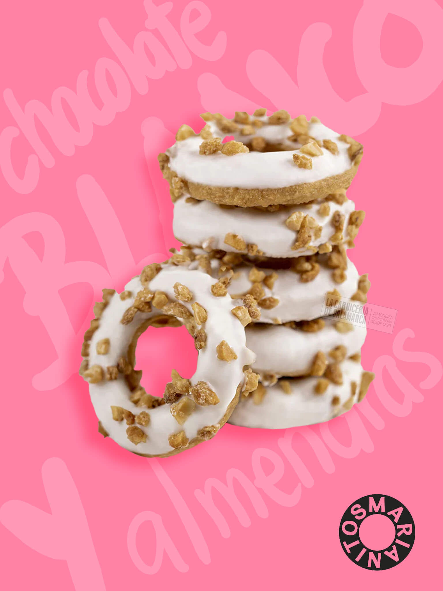 Marianitos de chocolate blanco con crocanti de almendra - Rosquillas crujientes con cobertura de chocolate blanco y trozos de almendra crujiente, ideales para disfrutar en cualquier momento. Descubre estos deliciosos Marianitos perfectos para acompañar tu café o como un capricho dulce en La Carnicería de Salamanca.